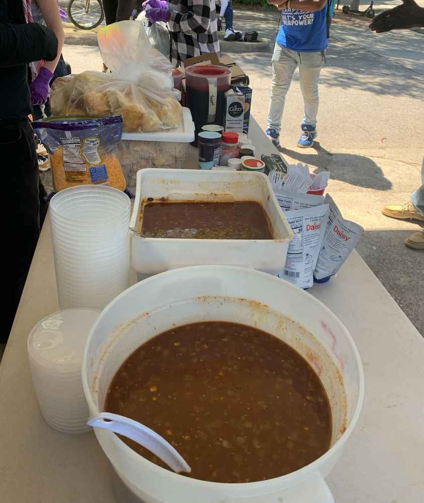 chili and beans in bowls with other utensils and condiments on our serving table.