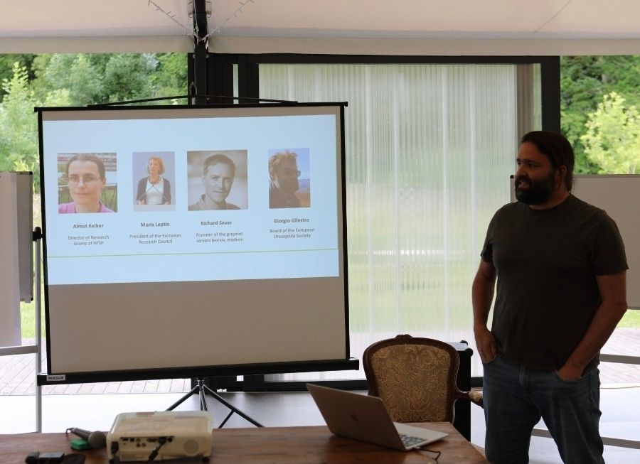 A picture of Nikos presenting our panel discussion 