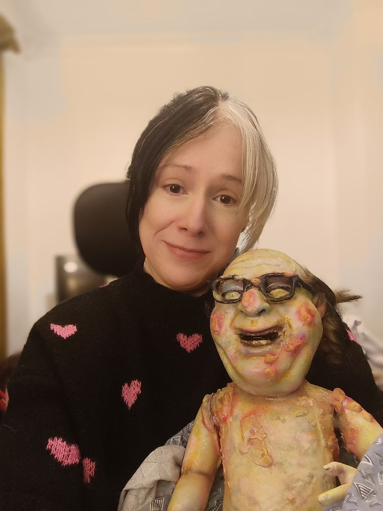 I am holding Danny DeVito. He looks a little weird but I'm sure he's fine.