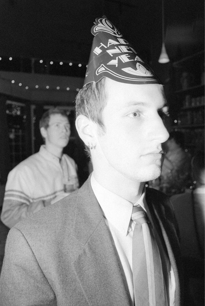 black and white photo of two men looking to the right 