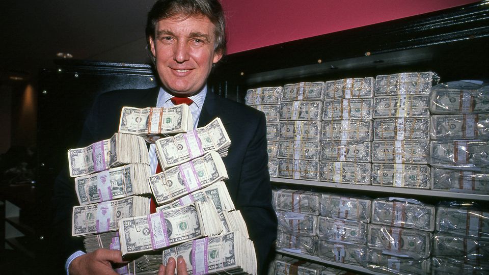 Trump holding money