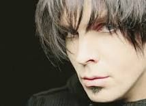 Garth Brooks as his alter ego 'Chris Gaines' a moody version of him in all black, bangs, and a devilish goatee. 