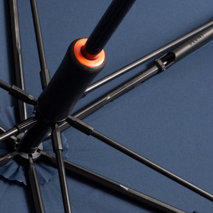 Umbrella structure with black and orange details.