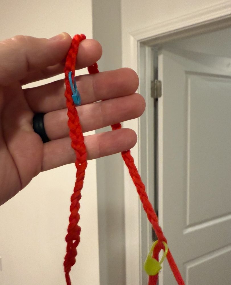 My hand holding up a crochet chain