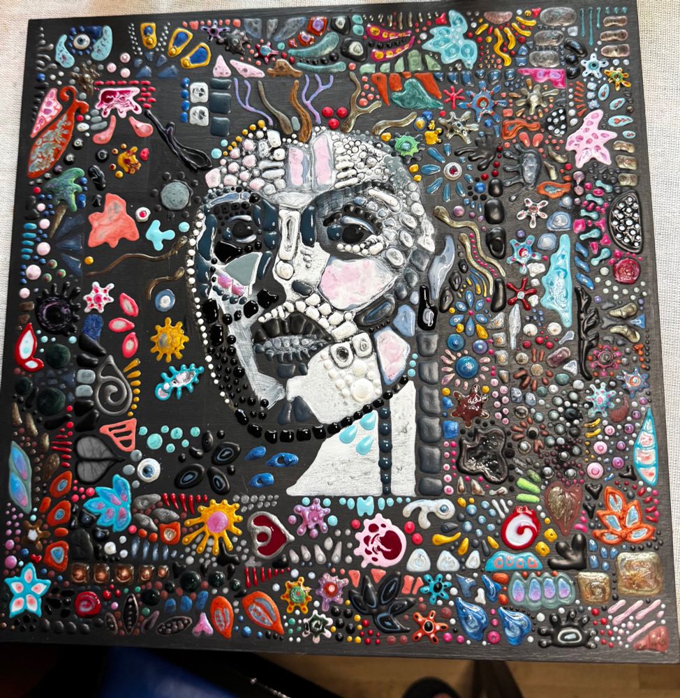 Stylized mosaic style painting of a woman’s face 