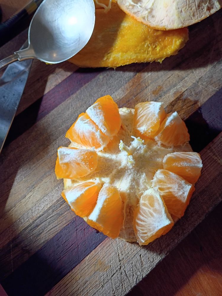 'orange' opened by slicing in half and inverting, making it really clean and easy to eat, not really sure how to describe it other than magic.