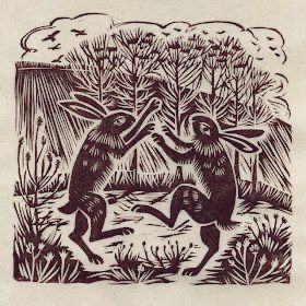 Linocut of hares boxing in field/trees landscape.