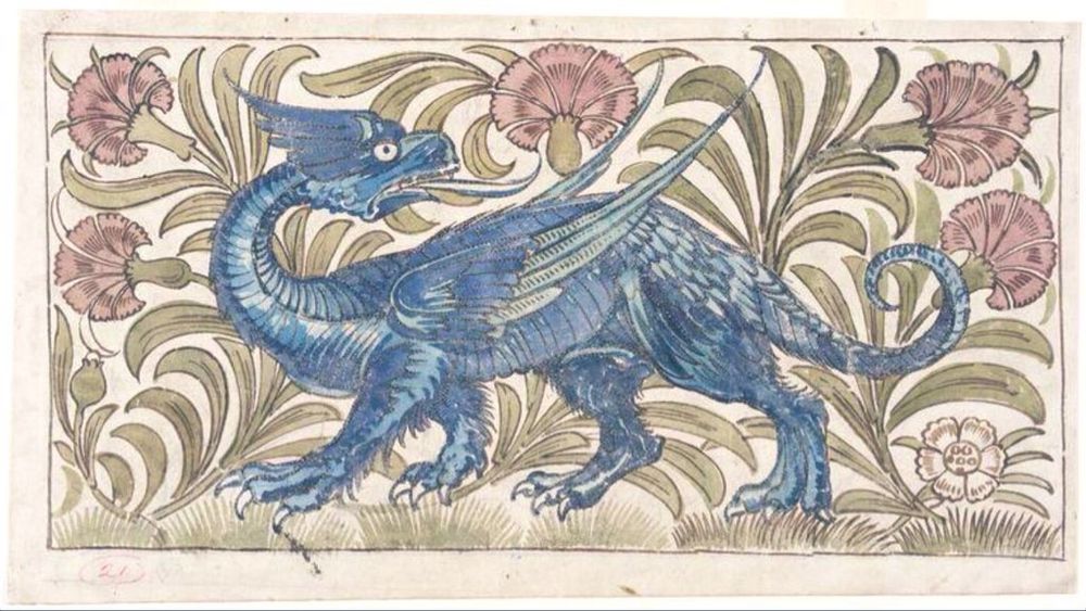 Tile with winged blue dragon surrounded by foliage and pink flowers.