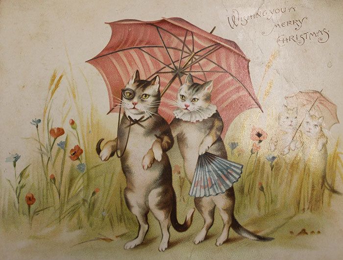 Two standing cats in garden with flowers walking beneath a red and white striped umbrella; one wears a monocle and a necktie, one holds a fan and wears a ruff, behind them walk another cat couple under an umbrella also, kind of faded into the distance, text says ‘wishing you a merry Christmas.
Vintage Christmas card.