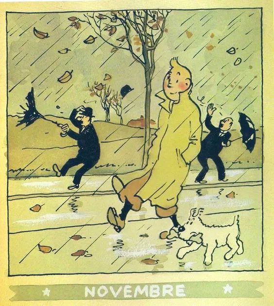 Illustration of a blustery, rainy day in November. Tintin, is shown in the foreground, wearing his yellow trench coat. He is walking forward with his dog, Snowy, who is carrying a stick in its mouth.
There are two other men in suits and bowler hats are struggling with the weather. One man on the left is having his umbrella turned inside out by the strong wind, while the man on the right is waving his arms as his hat is blown off his head.The scene is a street or sidewalk littered with fallen autumn leaves. Rain is falling heavily, and a bare-branched tree is visible in the background. 