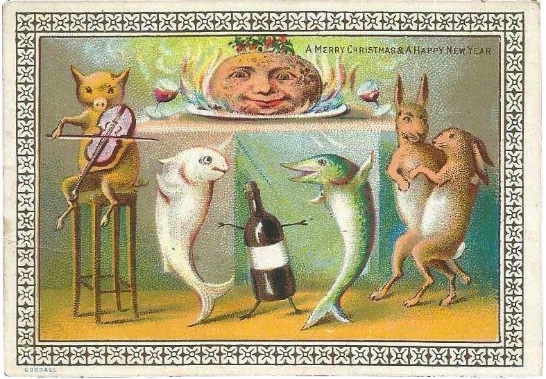 Victorian Christmas card, a pudding with a face sits in the centre of a Christmas table with a crown of holly and glasses of wine on either side, he has flames around him. In front of the table, a cat sits on a stool playing a fiddle whilst two fish dance with a bottle of wine that has arms and legs, to the right, two rabbits dance. 