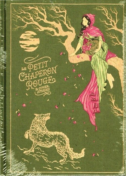 Book cover of Le Petit Chaperon Rouge & Other Stories - Little Red Riding Hood & Other Stories. Had a dark green background with gold accents, depicts a scene from the fairy tale:
Little Red Riding Hood: She is shown sitting in the branches of a tree, wearing a pink hooded cape and a green dress, holding a basket filled with what appear to be berries or flowers.
Below the tree, a wolf is looking up towards Little Red Riding Hood.
A stylized golden sun or moon is visible in the upper left, and small pink flowers are scattered across the green background. The title "LE PETIT CHAPERON ROUGE & OTHER STORIES" is prominently displayed in gold lettering.