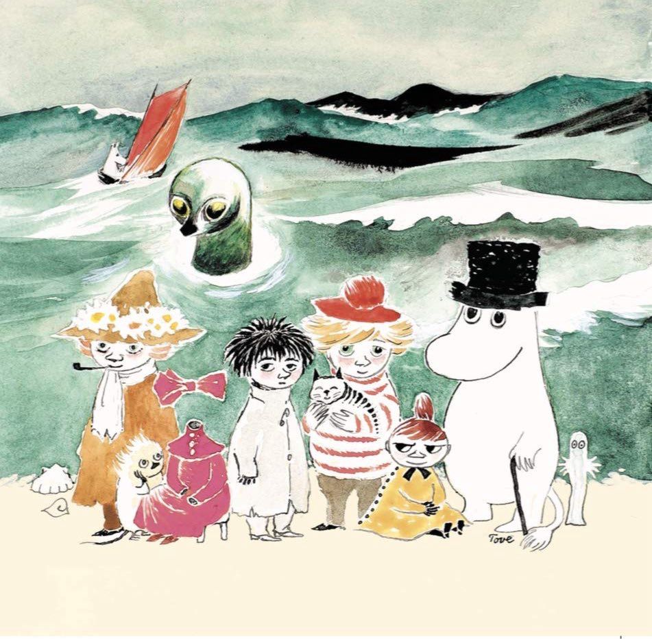 The image depicts several Moomin characters on a beach with a tumultuous sea in the background. 
Prominently featured are Moomintroll, Moominpappa in his top hat, Snorkmaiden, Little My, and Sniff, among others. 
The characters are gathered on a sandy beach, with a stormy, green-hued sea behind them. 
A large, green, owl-like sea monster emerges from the turbulent waters. 
In the distance on the stormy sea, two boats are visible, one with a prominent red sail.