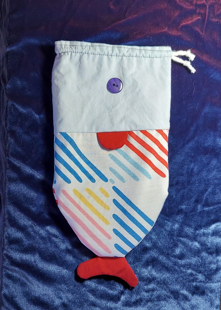 a cloth bag made to look like a fish