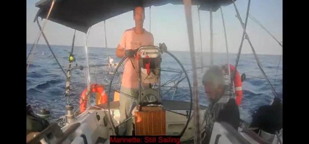 A man captaining the boat Marinette