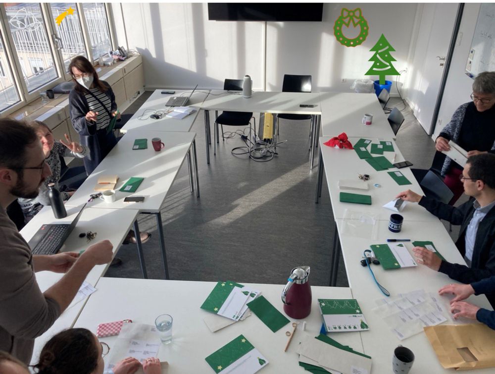 Group of people in the office writing christmas cards