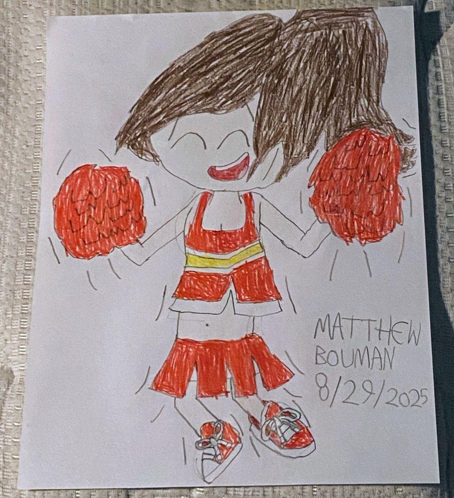 Lyla in a cheerleading outfit.