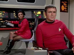Original Star Trek. Bridge of the Enterprise. Uhura at the com station and Scotty in the captain's chair. 