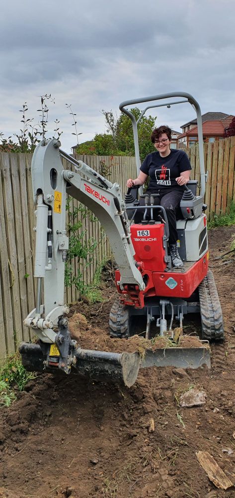My daughter having a play on a mini digger.