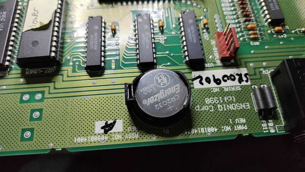 A CR2032 battery inside a holder