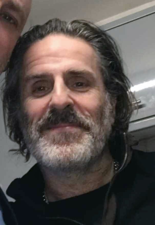 Con facial close-up, maybe on an airplane?