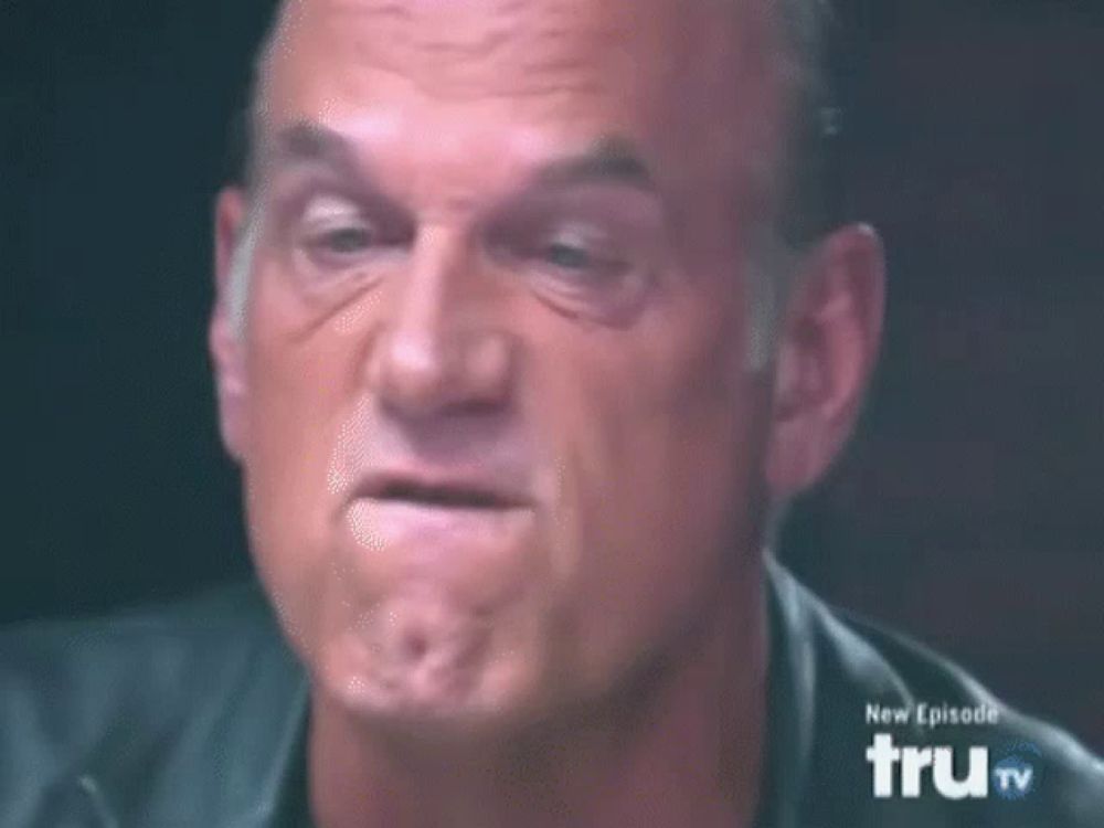 a man is making a funny face in front of a tv screen that says trutv