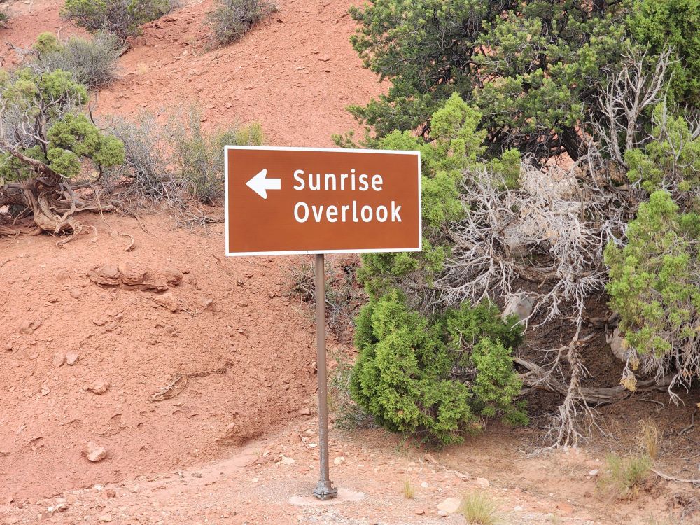 A sign at Dinosaur National Monument that says Sunrise Overlook, with an arrow