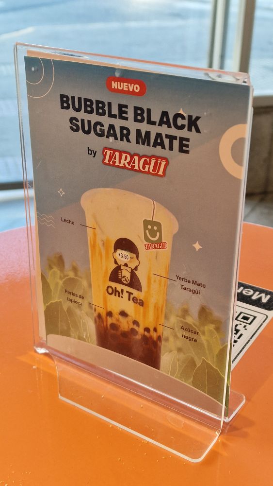 A sign at a boba shop advertising Bubble Black Sugar Mate, boba with yerba mate 