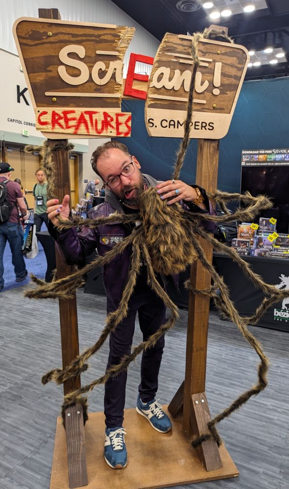 a picture of me getting a smooch from a very sexy booth babe (it's a giant spider)