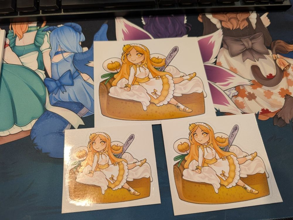 A picture of Pumpkin, the slime girl maid of The Lucky Clover! There are 3 stickers of different sizes available for giveaway in the image, of Pumpkin sitting on a piece of pumpkin pie