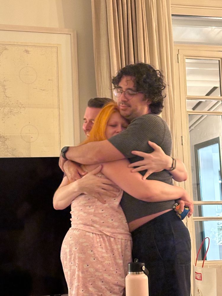 sacha joins the embrace and laughs at my pain