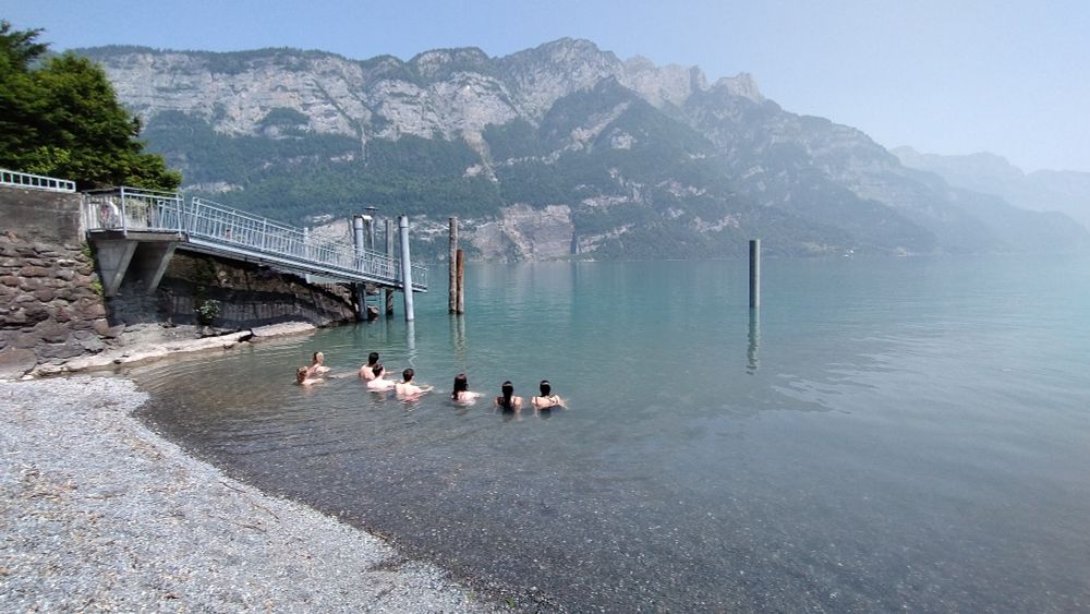 Swimmers in a Swiss mountain lake.