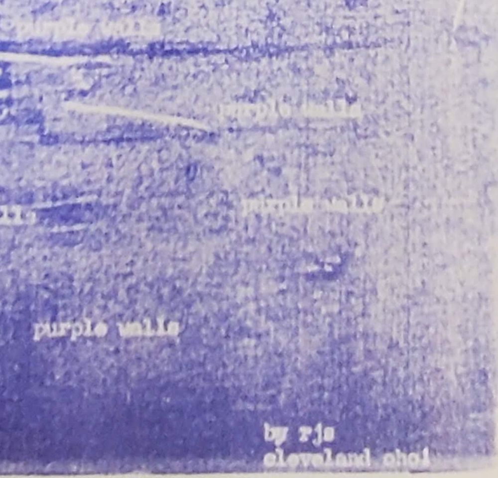 A photo of a poem, mostly filled with uneven purple ink. In white, the text 'purple walls' and 'by rjs / cleveland oho1'