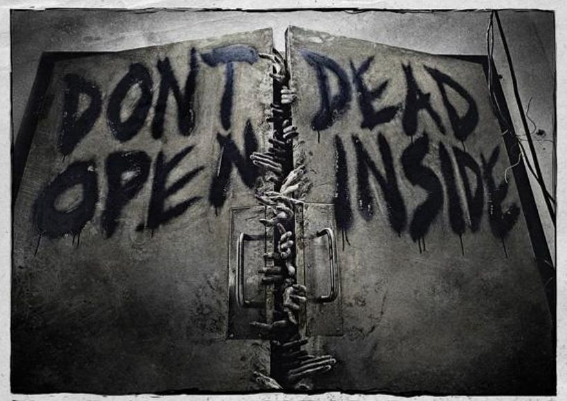 An image of closed doors bearing the text DONT OPEN on the left and DEAD INSIDE on the right. The text placement suggests an alternative reading, "DONT DEAD OPEN INSIDE"
