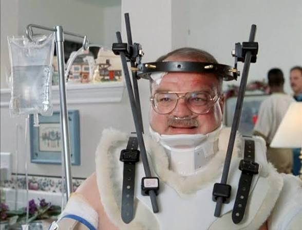Man in a neck brace from the movie Office Space