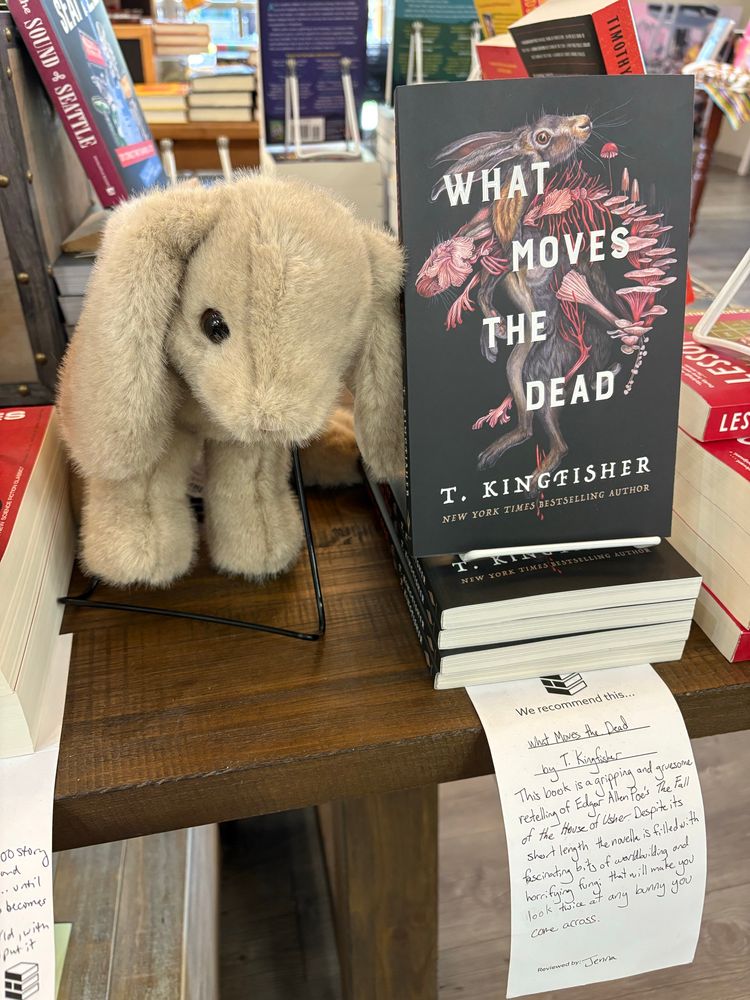 A very cute bunny posed next to What Moves the Dead.