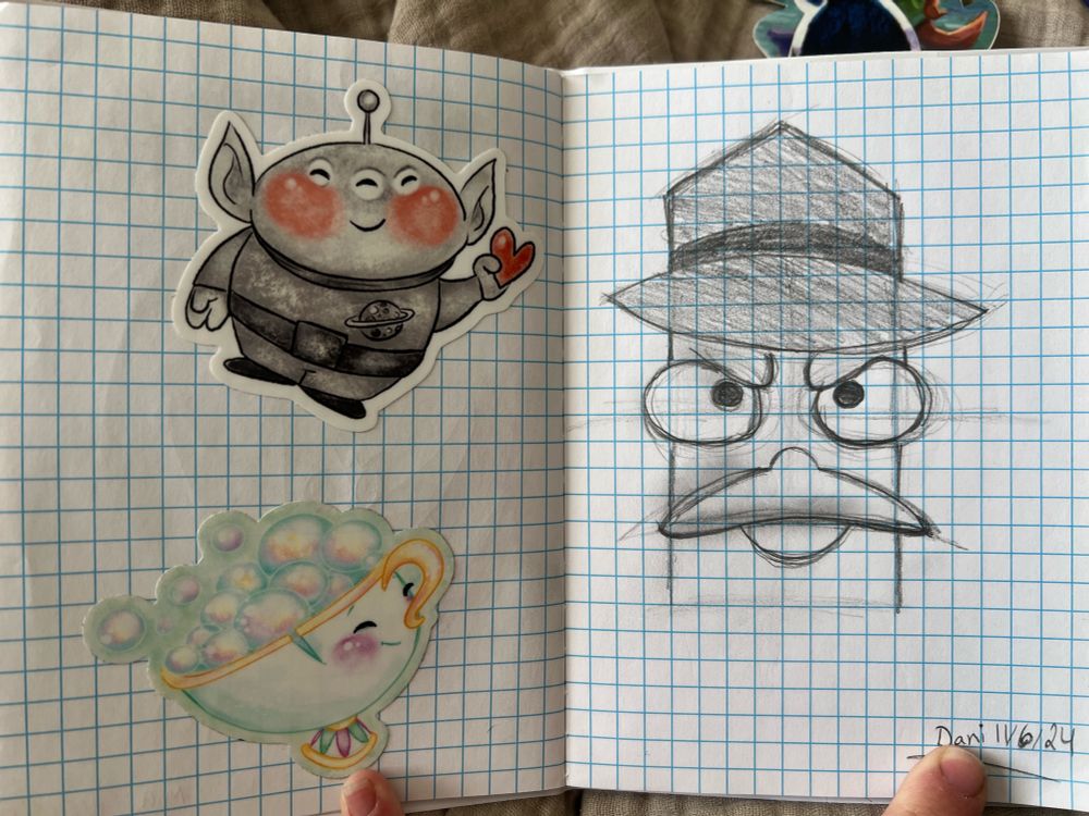 A sketch of Agent P (Perry the Platypus) on the right side of the gridlined sketchbook and on the right, there is a cute sticker of a Toy Story alien in black and white with red cheeks and holding a red heart. There is also a watercolor sticker of Chip blowing bubbles in his cup from Beauty and the Beast. 