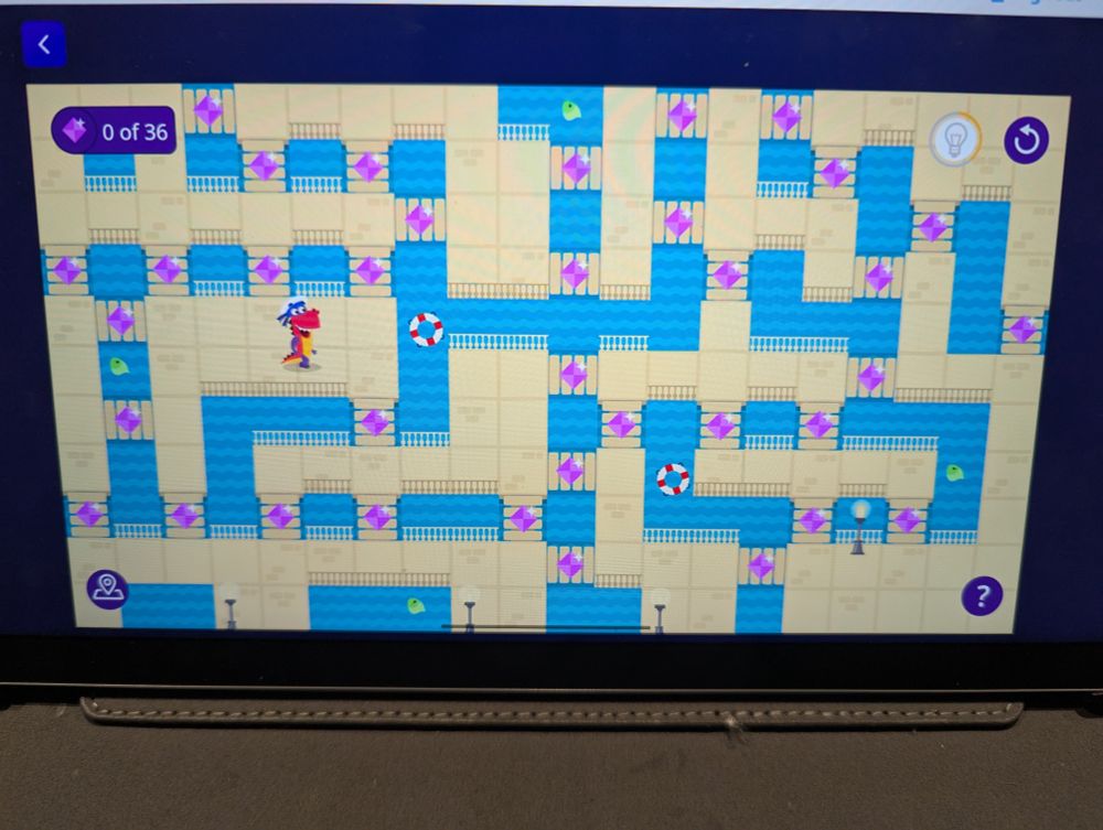A 2D maze game where you guide a dinosaur across a landscape with many bridges. Each bridge has a diamond on it. Notably, two of the locations have an odd number of bridges connected to it, which makes the maze impossible unless you start/end on those specific nodes.