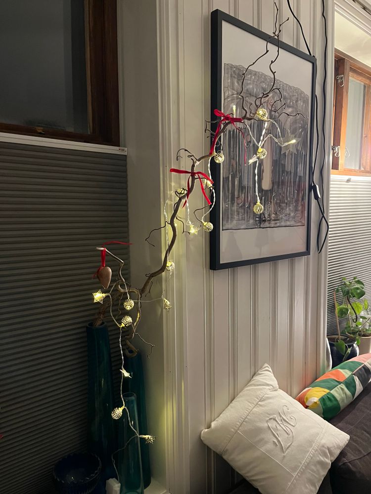 Light ornaments in a hazel branch