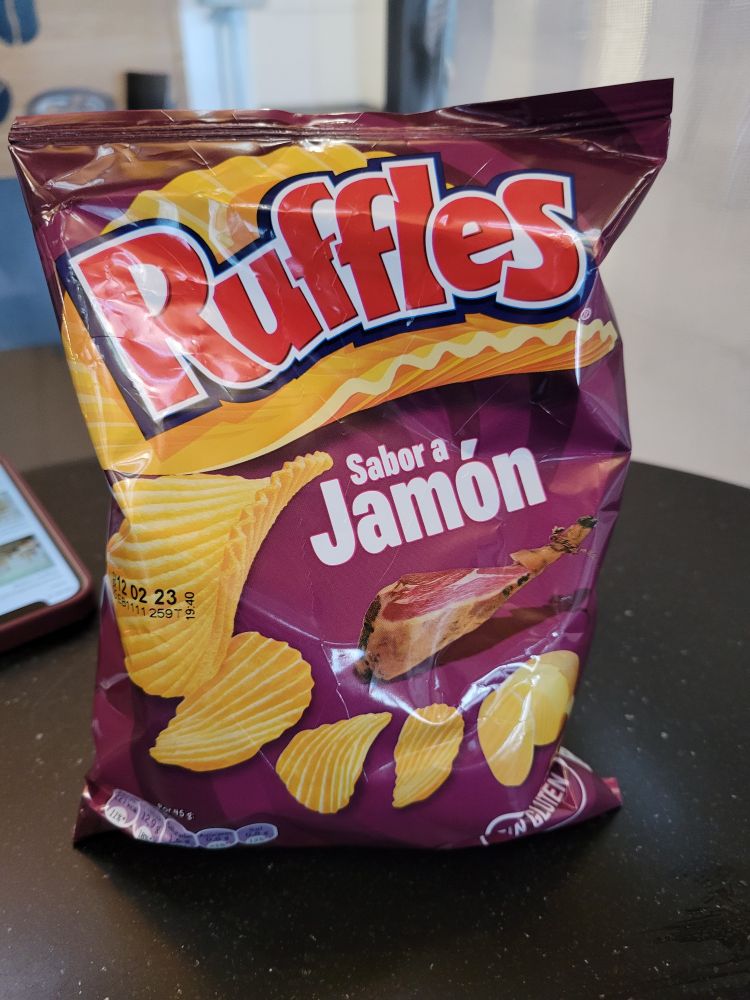 A purplish bag of Sabor a Jamón Ruffles chips.