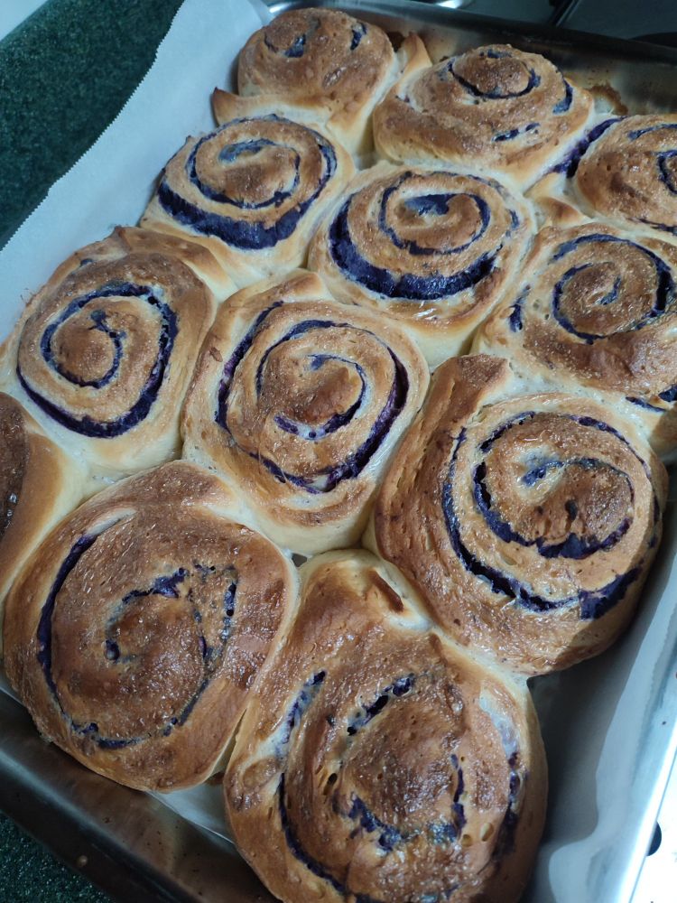 A pan of freshly baked ube rolls.