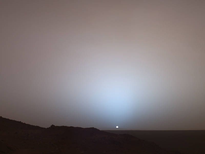 This photo shows a sunset on Mars which looks more grey and blue than one on Earth 