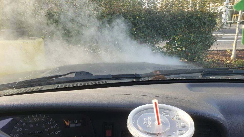Steam rising from my trucks engine compartment. 