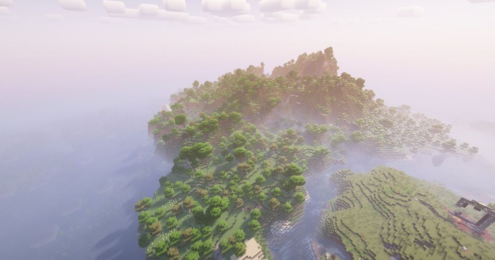 A screenshot of a minecraft world, taken from high up. This is the exact same world as the previous picture, but this one is completely empty. The only structure that remains is a ruined nether portal.