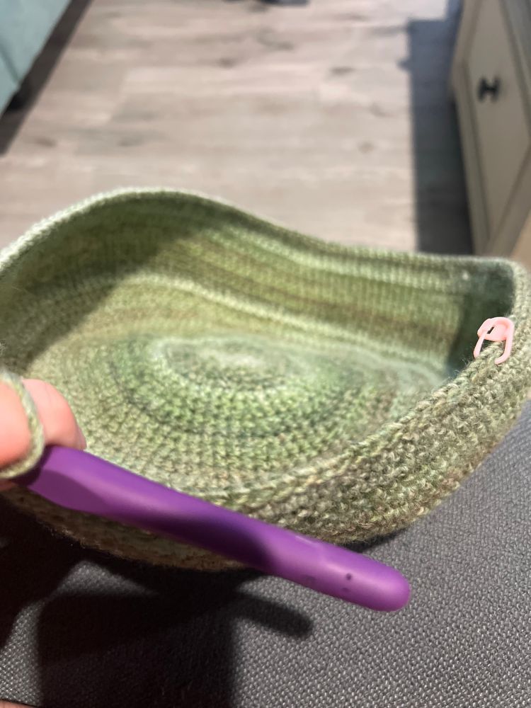 A crochet bag in progress so it’s more like a fuzzy bowl