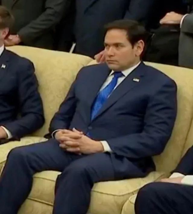 Marco Rubio sitting on a couch uncomfortably
