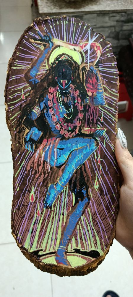 acrylic marker drawing of Kali Maa on a slab of wood