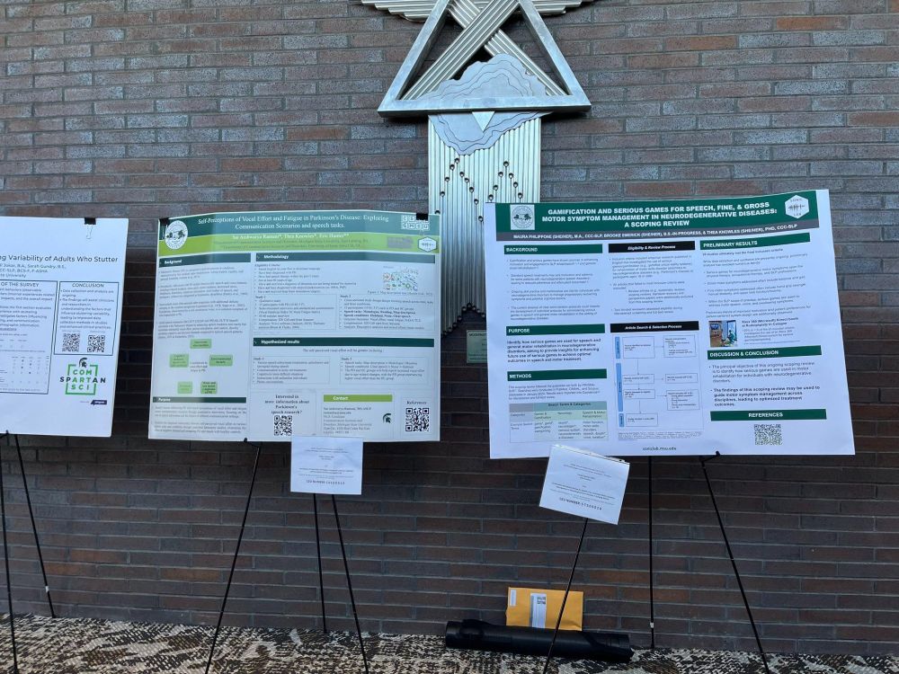 Two academic posters on easels with MSU colors (green & white).