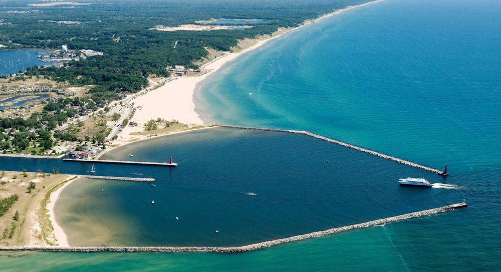 View of Muskegon, MI (blue costal shore) from https://www.cruisethegreatlakes.com/ports/muskegon-michigan/
