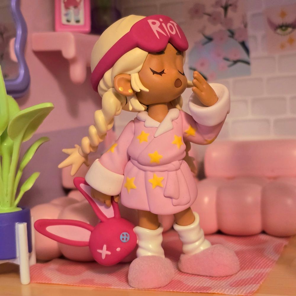 A little riot bedtime poppy yawning in the middle of the living room. 